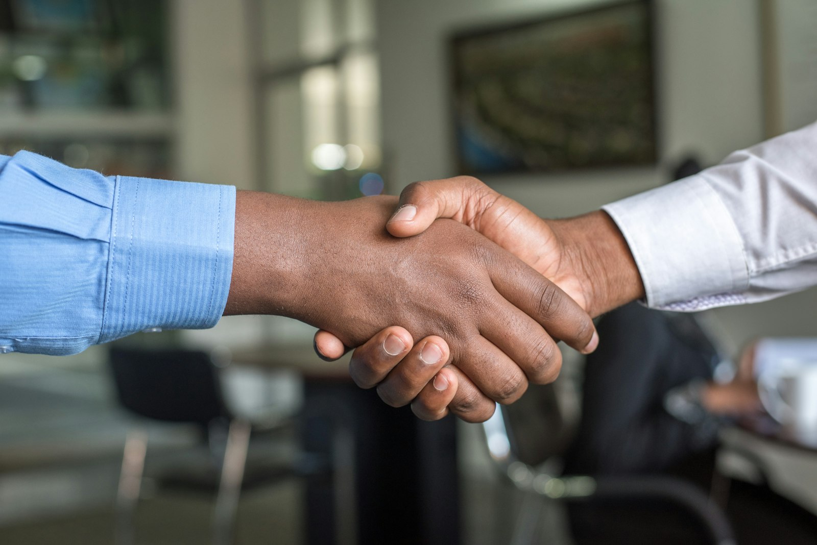 A professional handshake closing an agreement between partners